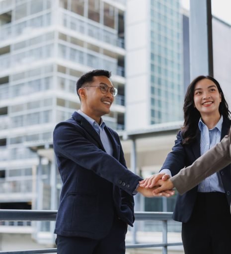 business-team-joining-hands-in-modern-city-showin-2026-01-09-10-45-59-utc (1)